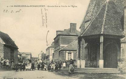 CPA FRANCE 27 "La Madeleine de Nonancourt, grande rue et porche de l'Eglise"