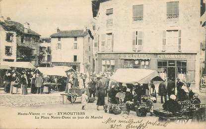 CPA FRANCE 87 "Eymoutiers, la Place Notre Dame un jour de Marché" / PHARMACIE / CHAPELLERIE