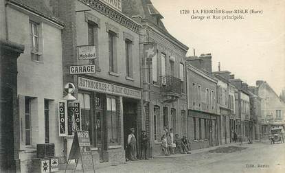 CPA FRANCE 27 " La Ferrière sur Risle, Garage et rue Principale" / Electricité / Automobile