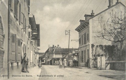 / CPA FRANCE 01 "Divonne Les Bains, rue principale et postes"