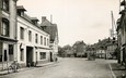 CPSM FRANCE 27 "Montreuil l'Argille, Hotel du cheval blanc et la place du Marché"