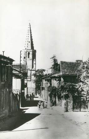 . CPSM FRANCE 32 "Panjas, Eglise et rue principale"