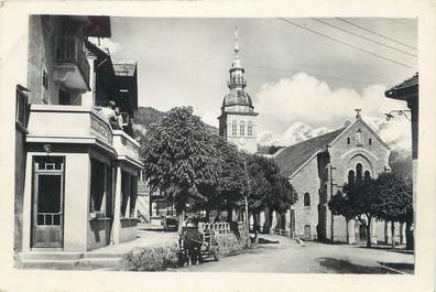 CPSM FRANCE 74 " Le Grand Bornand, L'église et le café de lla poste'".