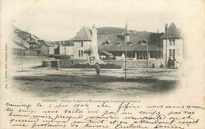 CPA FRANCE 38 " Crémieu, Groupe scolaire et monument aux morts" /GUERRE DE 1870