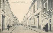 91 Essonne CPA FRANCE 91 " Montlhéry, La grande rue et la Mairie"