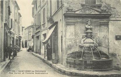 CPA FRANCE 13 " St Rémy de Provence, Rue Carnot et Fontaine Nostradamus"
