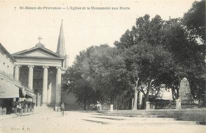 CPA FRANCE 13 " St Rémy de Provence, L'église et le monument aux morts"