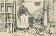 CPA FRANCE 77 "1914, Femme de 90 ans près d'une maison détruite à Morin"