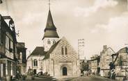 27 Eure / CPSM FRANCE 27 "Serquigny, l'église et rue Max Carpentier"